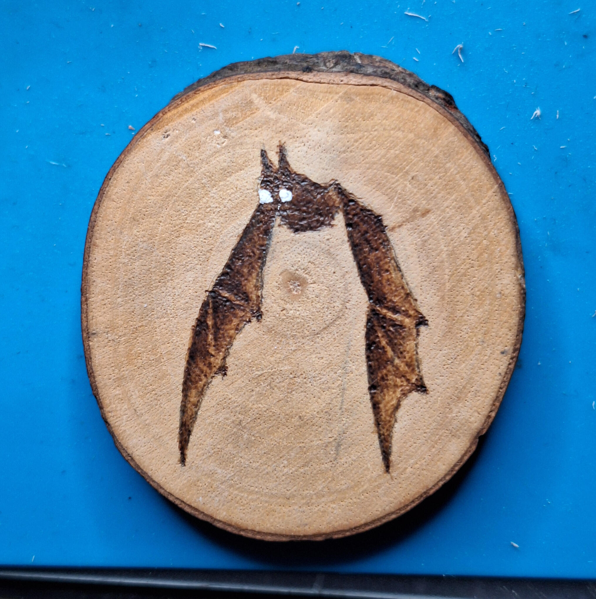 Baby Bat burned on Wood